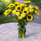 sunflowers and yellow roses in a vase
